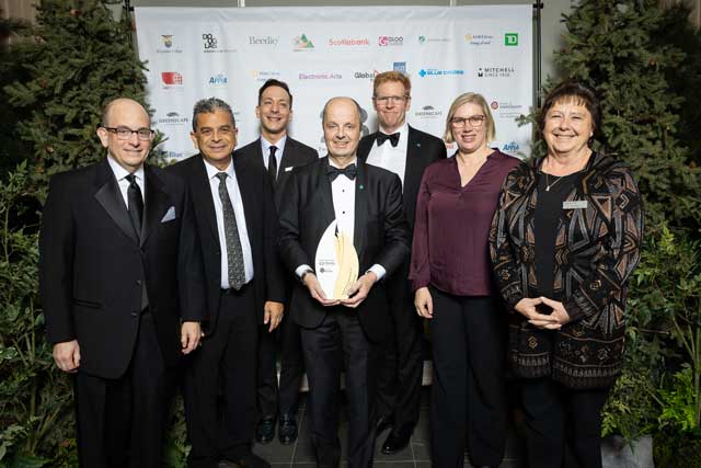 Pacific Blue Cross executives accepting the BBHOF award