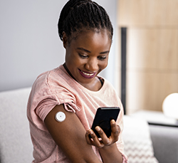 Woman testing glucose